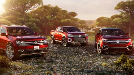 Vibrant Red Volkswagen Pickup Trucks in Nature wallpaper