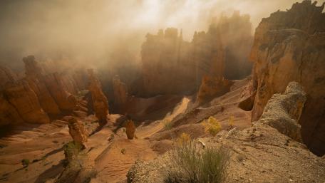 Majestic Desert Landscape with Misty Rocks wallpaper
