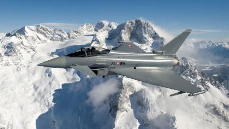Eurofighter Typhoon Soaring Over Majestic Peaks wallpaper