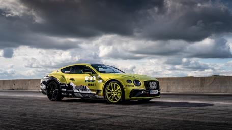 Sleek Bentley Continental GT in Striking Yellow Finish wallpaper