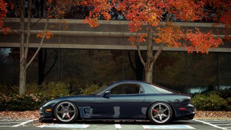 Sleek Mazda RX-7 Among Vibrant Autumn Foliage wallpaper