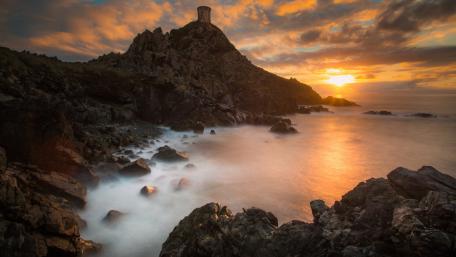 Serene Sunset Over Coastal Promontory wallpaper
