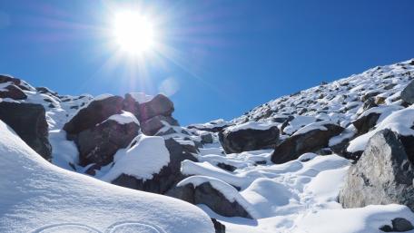 Winter Sunlight Over Snowy Mountains wallpaper