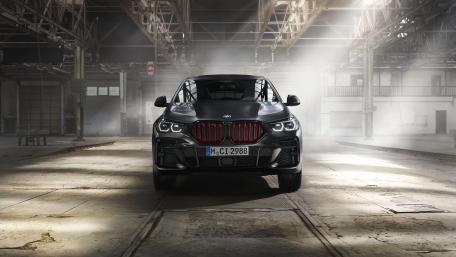 Sleek BMW X5 in an Industrial Setting wallpaper