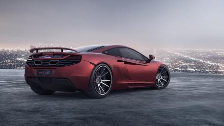 Sleek McLaren MP4-12R Against a Stunning Cityscape View wallpaper