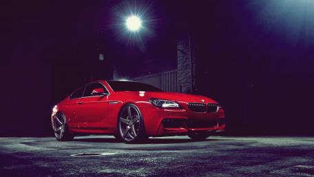 Sleek Red BMW Sports Car in Dim Light wallpaper
