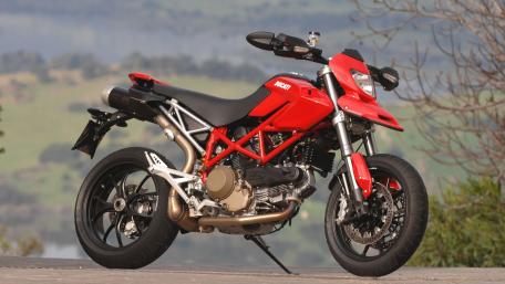 Vibrant Ducati Hypermotard on Scenic Overlook wallpaper