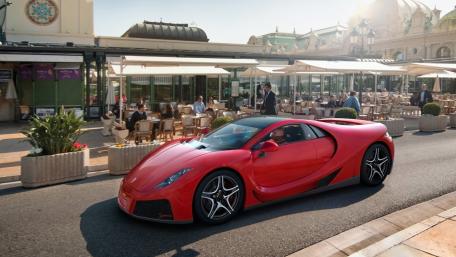 Sleek Red Spania GTA Spano in Urban Setting wallpaper