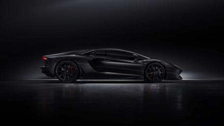 Sleek Black Lamborghini in Shadowy Elegance wallpaper