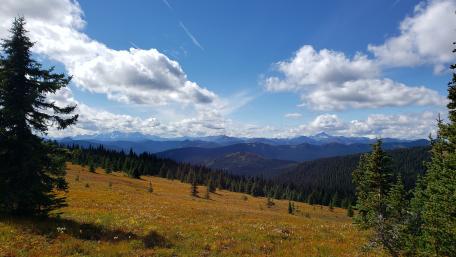 Majestic Mountain Vista Underneath Beautiful Blue Skies wallpaper