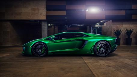 Sleek Green Lamborghini Aventador in Urban Setting wallpaper