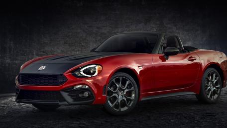 Sleek Fiat 124 Spider in Stunning Red and Black wallpaper
