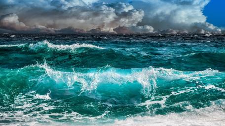 Fierce Ocean Waves Under Stormy Skies wallpaper