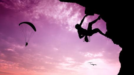 Daring Climbers Under Purple Skies wallpaper
