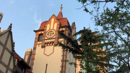 Historic Clock Tower in a Modern Cityscape wallpaper