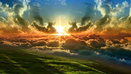Sunrise Over a Cloud-Covered Field wallpaper