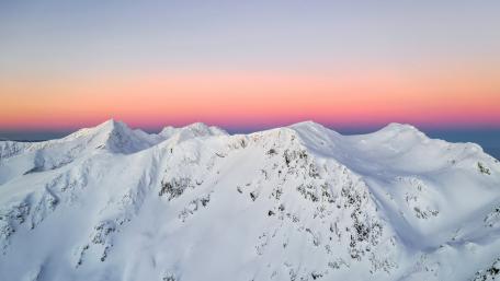 Purple pink sky and snow mountains wallpaper
