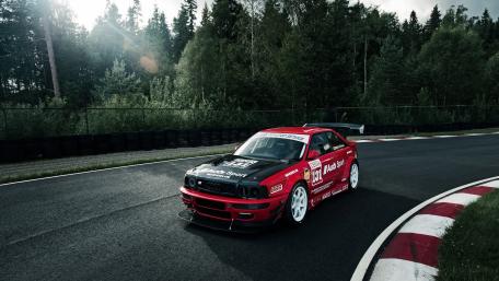 Adrenaline-Fueled Audi Racing Car Wallpaper wallpaper