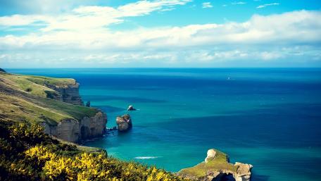 Serene Cliffs Overlooking Tranquil Sea wallpaper