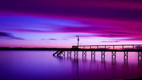 Serene Pier Under a Purple Sky wallpaper