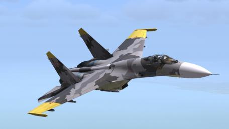 Dynamic Sukhoi Su-27 in Flight Over Scenic Skies wallpaper