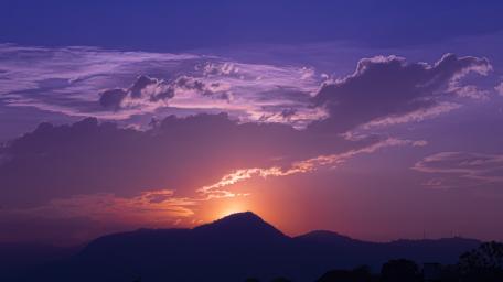 Purple Sunset Over Mountain Tops wallpaper