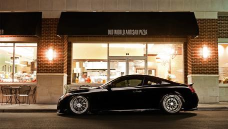 Sleek Luxury Car on a Night Out wallpaper