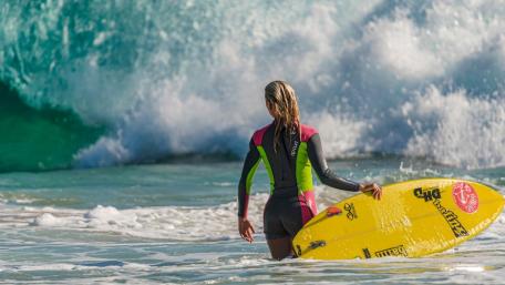 Vibrant Surfing Adventure on the Shore wallpaper