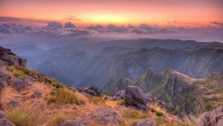 Serene Mountain Sunset Over Lush Valleys wallpaper
