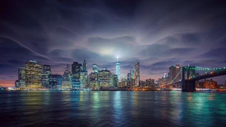 The Brooklyn Bridge and the Empire State Building at night wallpaper