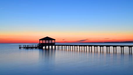 Sunset Over Tranquil Lake Pier wallpaper
