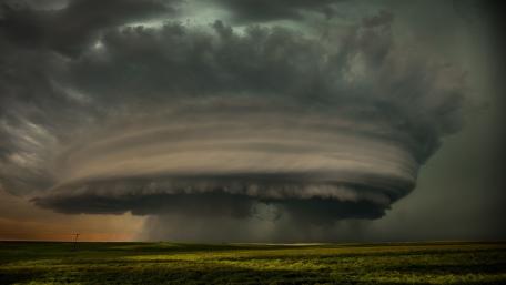 Whirlwind Over a Tranquil Meadow wallpaper