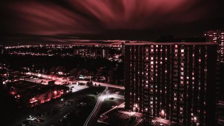 Enchanting Night Cityscape with Red Skies wallpaper