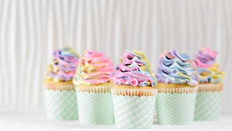 Colorful Cupcakes with Delightful Frosting in Pastel Shades wallpaper