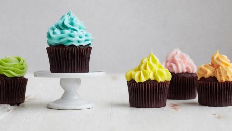 Delightful Colorful Cupcakes Displayed Elegantly wallpaper