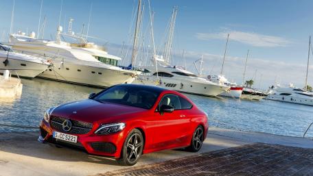 Sleek Red Mercedes by the Marina wallpaper