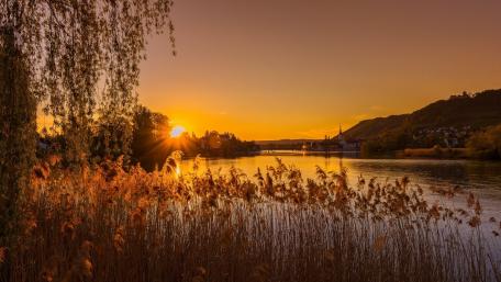 Golden Autumn Sunset Over Tranquil Lake wallpaper