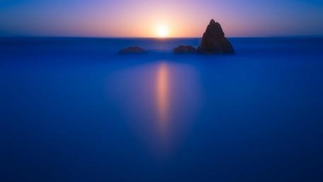 Serene Sunset Over the Sea Stack wallpaper