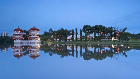Serene Pagoda Reflection in Tranquil Waters wallpaper