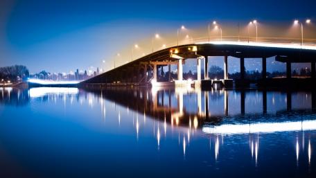 Nighttime Bridge Reflection Over Water wallpaper