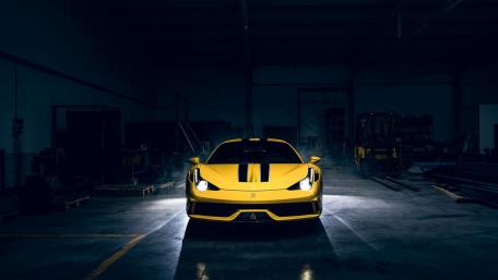 Vibrant Yellow Ferrari in Dramatic Lighting wallpaper