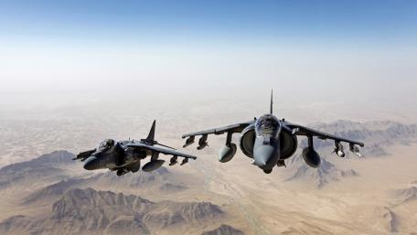 Powerful Jets in Formation Flight Over Desert Landscape wallpaper