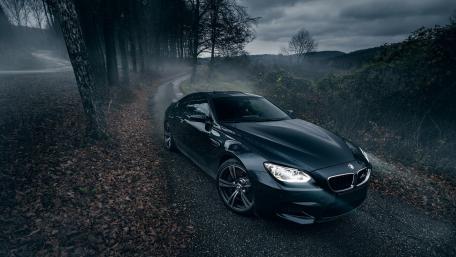 Dark Majesty of the BMW M6 on a Twisting Road wallpaper