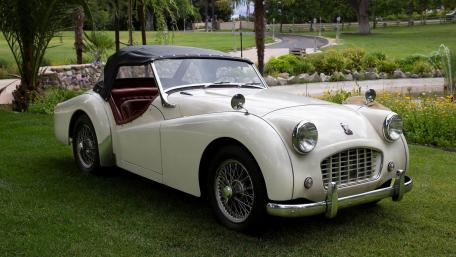 Classic Triumph TR3 in Elegant White Finish wallpaper