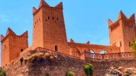 Majestic City Castle with Towers and Blue Sky wallpaper