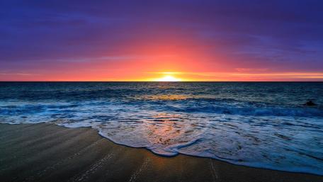 Sunset Serenity on a Sandy Beach wallpaper