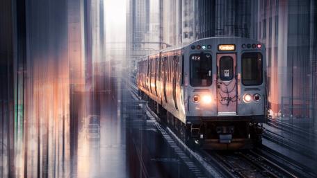 Urban Train Journey in the Rainy Cityscape wallpaper