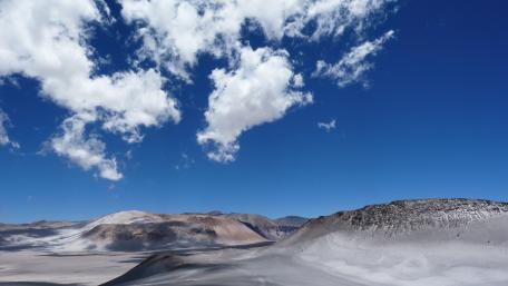 Breathtaking Desert Landscape Under Open Blue Sky wallpaper