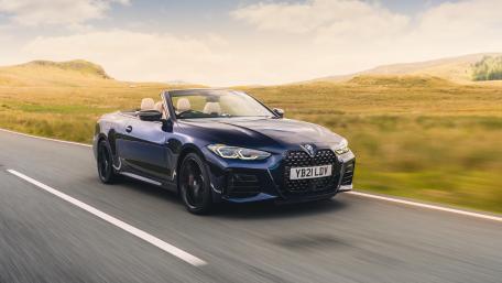 Sleek BMW M4 Cabriolet in Scenic Landscape wallpaper