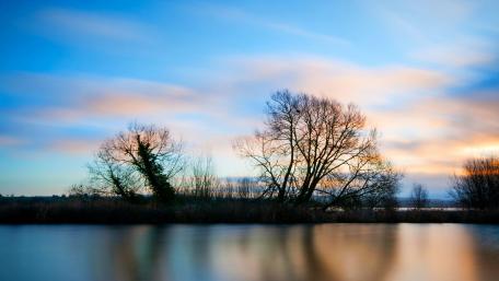 Tranquil Lake at Dusk Awash with Colorful Sky wallpaper